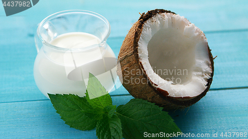 Image of Cup of milk and half of coconut