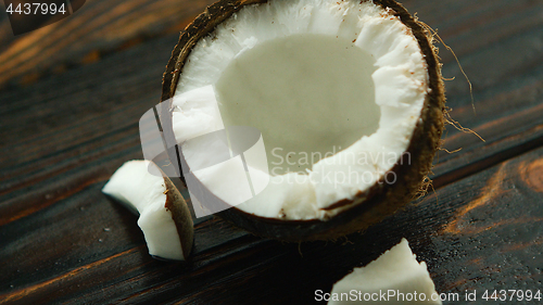 Image of Cracked coconut on table 