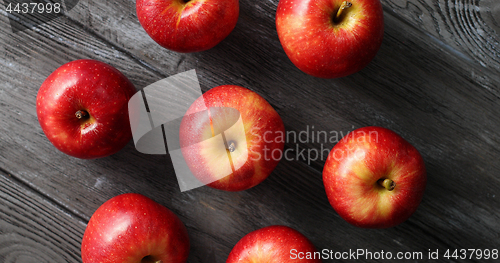 Image of Red ripe apples on wooden table