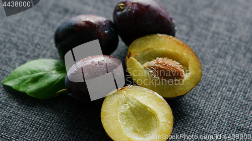 Image of Delicious juicy plums on napkin