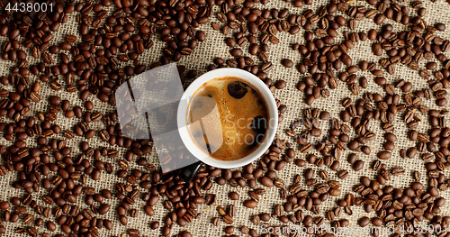 Image of Cup of espresso and coffee beans