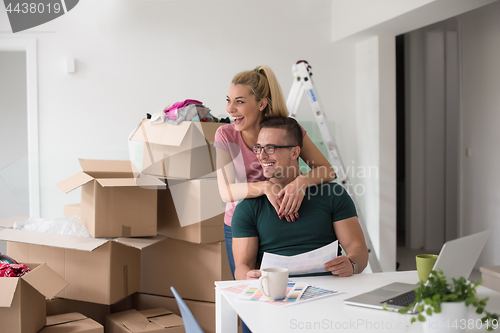 Image of Young couple moving in a new home