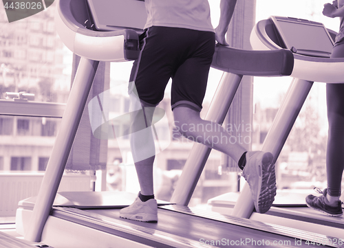 Image of sportsman exercise jogging on treadmill