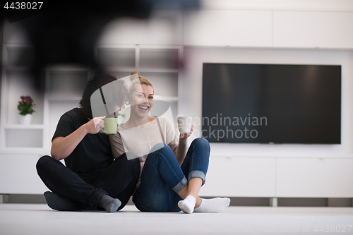 Image of young couple in their new home