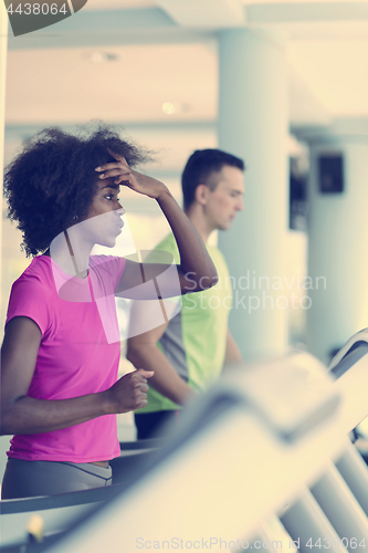 Image of people exercisinng a cardio on treadmill in gym