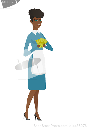 Image of Happy african cleaner holding money.