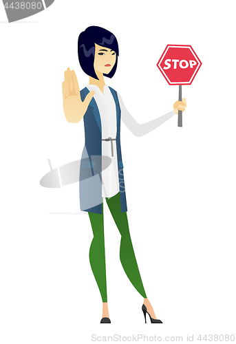 Image of Asian business woman holding stop road sign.