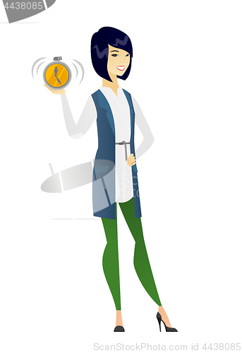 Image of Asian business woman holding alarm clock.