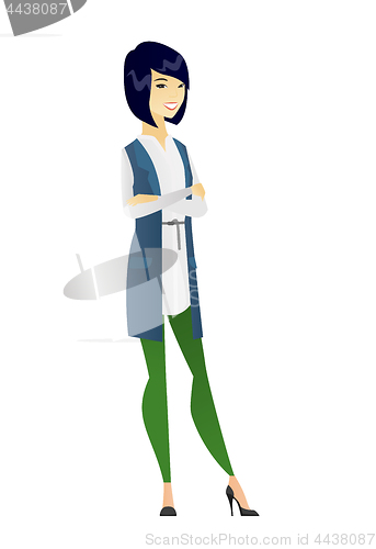 Image of Asian business woman standing with folded arms.