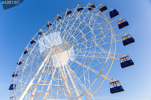 Image of Ferris wheel under sunshine