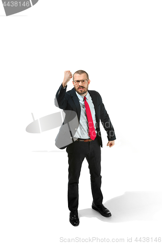 Image of Angry businessman threatening and pointing to camera. Isolated on white.