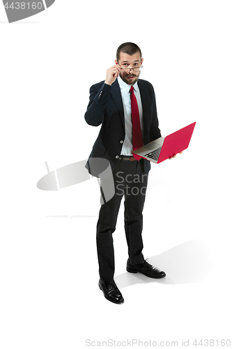Image of Picture of handsome young bearded man standing over white studio background with laptop