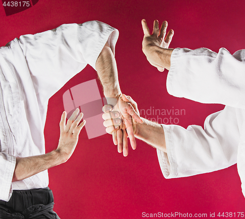 Image of Two men fighting at Aikido training in martial arts school