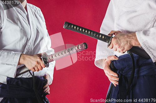 Image of The two men are training Aikido at studio