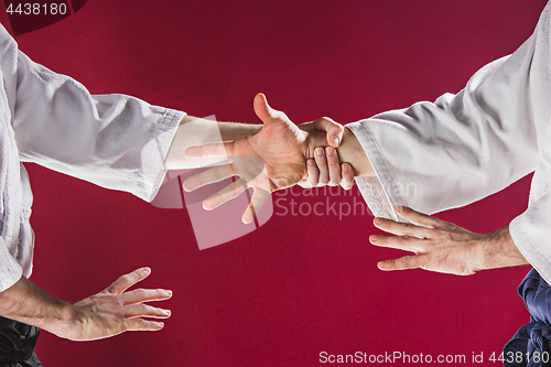 Image of Two men fighting at Aikido training in martial arts school