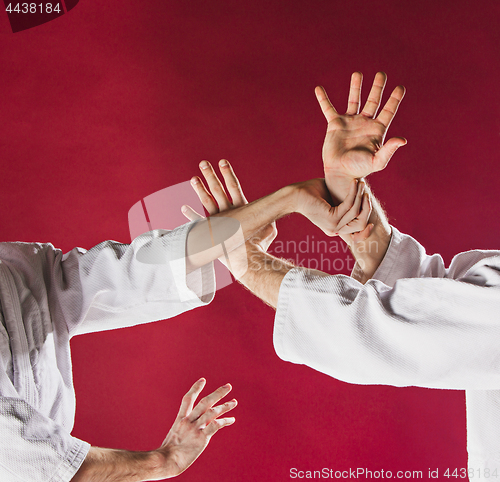 Image of Two men fighting at Aikido training in martial arts school