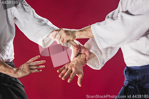 Image of Two men fighting at Aikido training in martial arts school