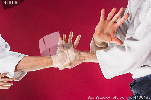 Image of Two men fighting at Aikido training in martial arts school