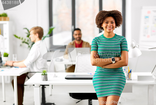 Image of happy smiling african american woman at office