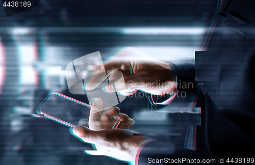 Image of close up of businessman with glass smartphone