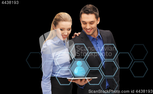 Image of businesspeople with tablet pc and network hologram