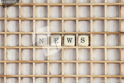 Image of News sign created with wooden dices