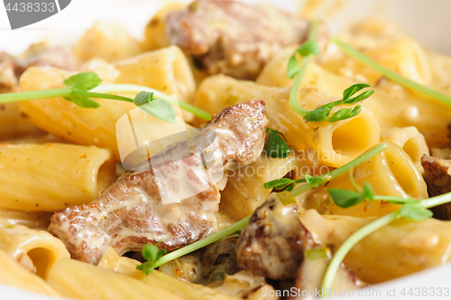 Image of penne pasta with veal meat