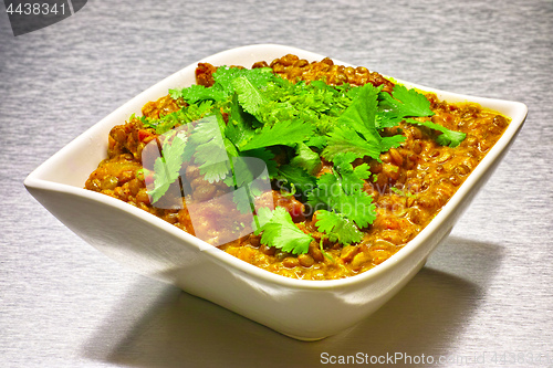 Image of Moong Dahl, indian vegetarian lentil soup in white bowl.