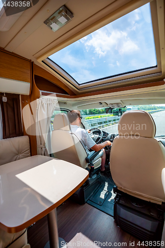 Image of Man driving on a road in the Camper Van RV