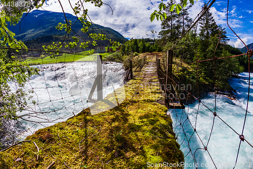 Image of Suspension bridge over the mountain river, Norway.