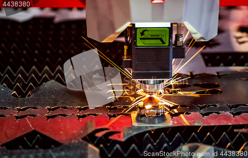 Image of CNC Laser cutting of metal, modern industrial technology.