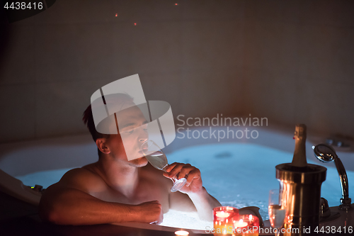 Image of man relaxing in the jacuzzi
