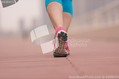 Image of woman running on the promenade