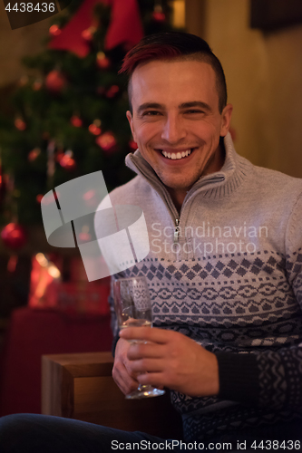 Image of Happy young man with a glass of champagne