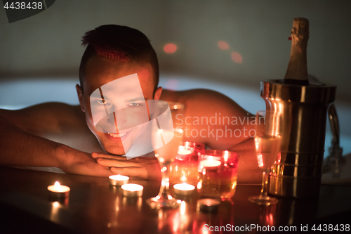 Image of man relaxing in the jacuzzi