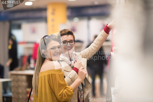 Image of best friend shopping in big mall