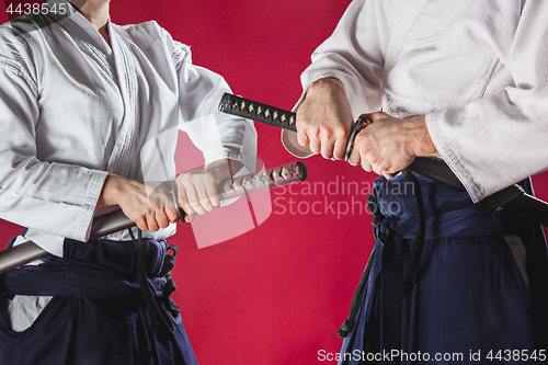 Image of The two men are training Aikido at studio