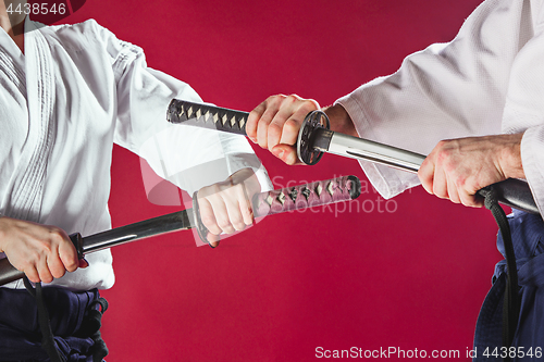 Image of The two men are training Aikido at studio