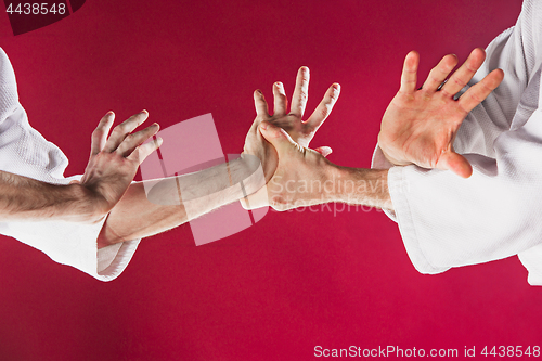 Image of Two men fighting at Aikido training in martial arts school