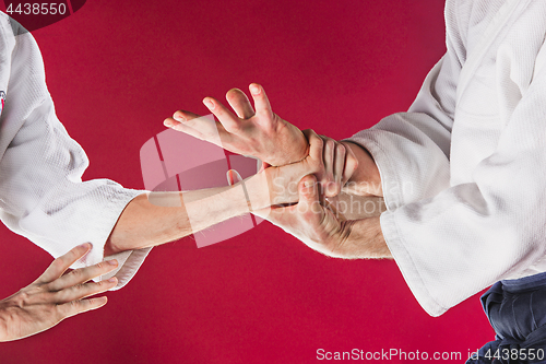 Image of Two men fighting at Aikido training in martial arts school