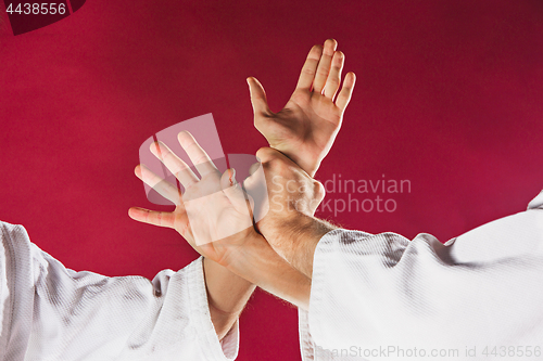 Image of Two men fighting at Aikido training in martial arts school