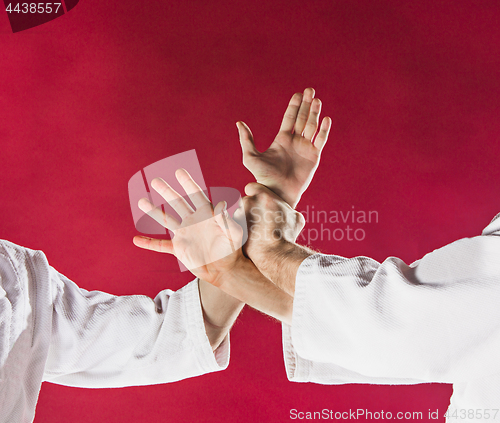 Image of Two men fighting at Aikido training in martial arts school