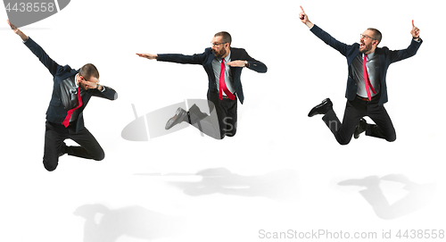 Image of Funny cheerful businessman jumping in air over white background