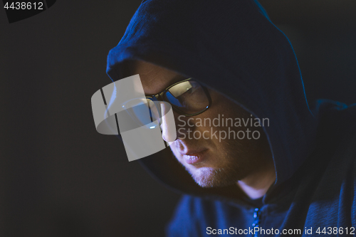 Image of close up of hacker in glasses and hoodie