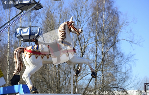 Image of carousel horse in an amusement park