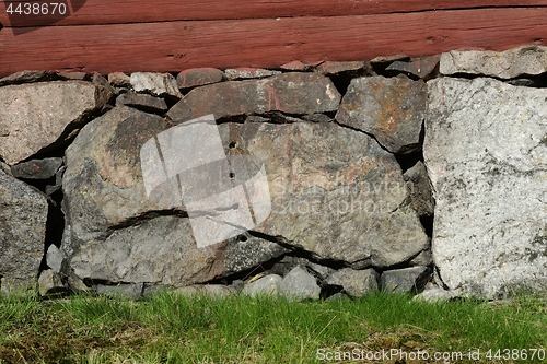 Image of old masonry in the basement of a wooden house