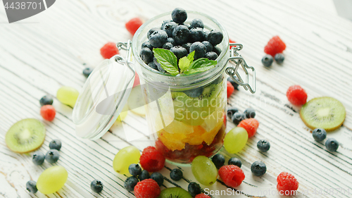Image of Jar filled with colorful fruit