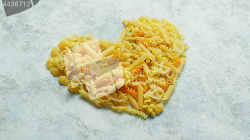 Image of Different macaroni laid in shape of heart