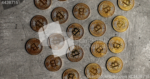 Image of Golden bitcoins on gray surface