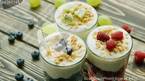 Image of Glasses with fruit and yogurt desserts 
